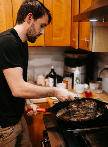 Seth cooking steaks